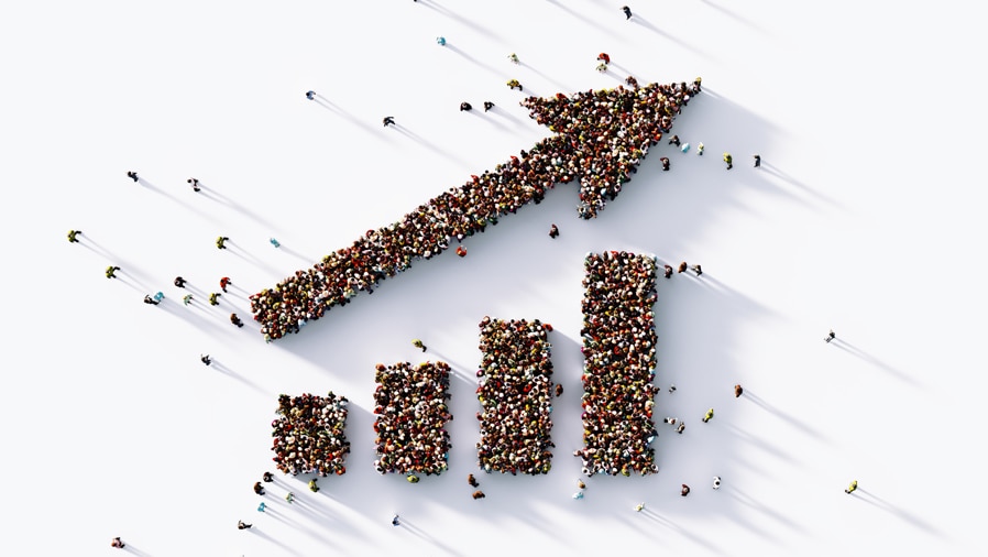 Human crowd forming an upward arrow